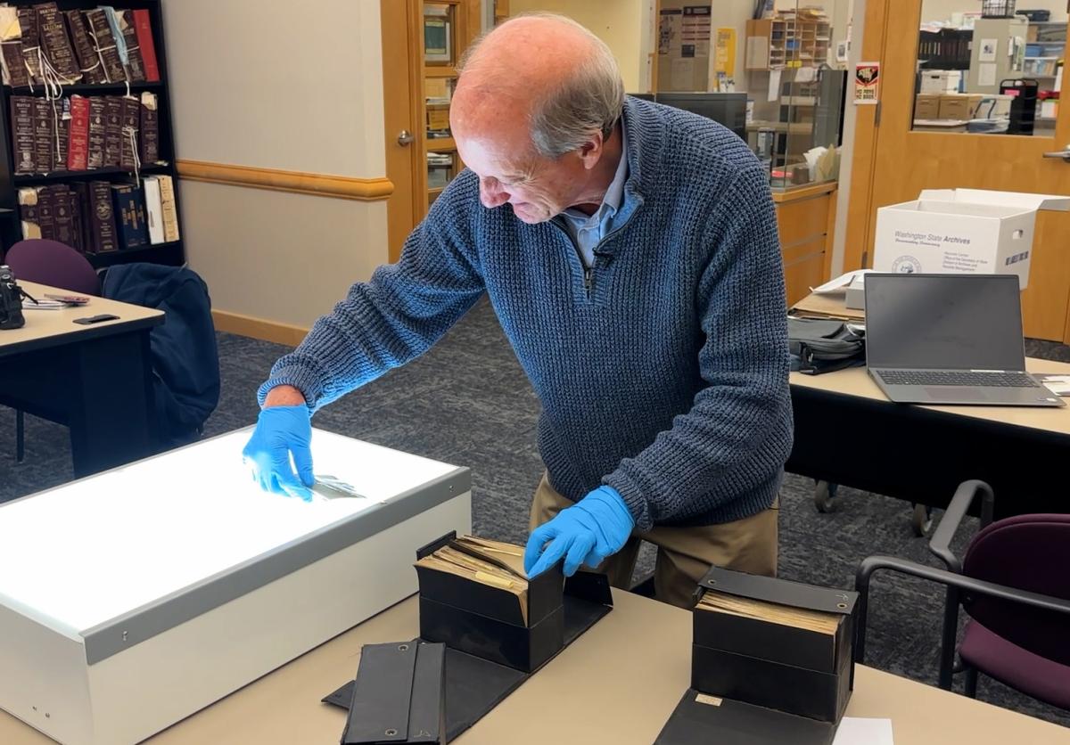 Rod Koon looking at negatives